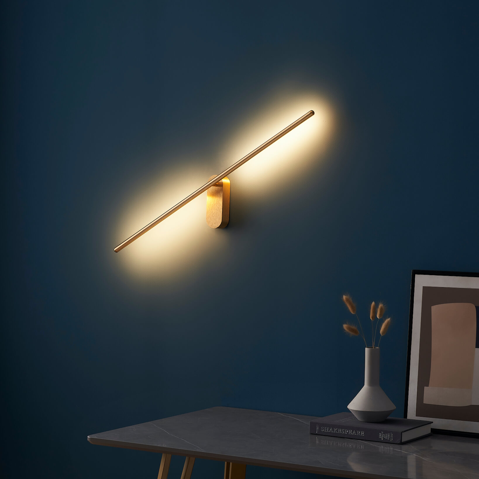 Long golden pivoting wall lamp Melbourne